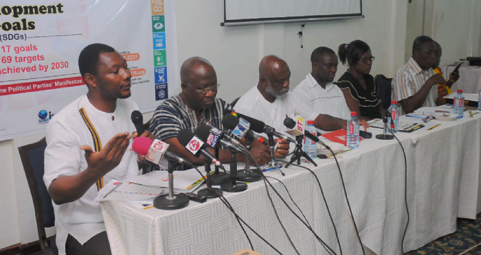 Mr Bernard Mornah (left), Chairman, PNC, making a point at the a public forum on SDGs organised by ISODEC for political parties in Accra. Those with him are, from 2nd left, Dr Graham Ahadzi, Director of Research, NDC, Prof. Kwame Karikari, Moderator, Mr Ato Dadzie, GCPP, Ms Bridget Boafo, PPP, Mr Kojo Afari, NPP and Mr Yaw Adu Larbi, Deputy Communication Director, CPP. Picture: EMMANUEL ASAMOAH ADDAI 